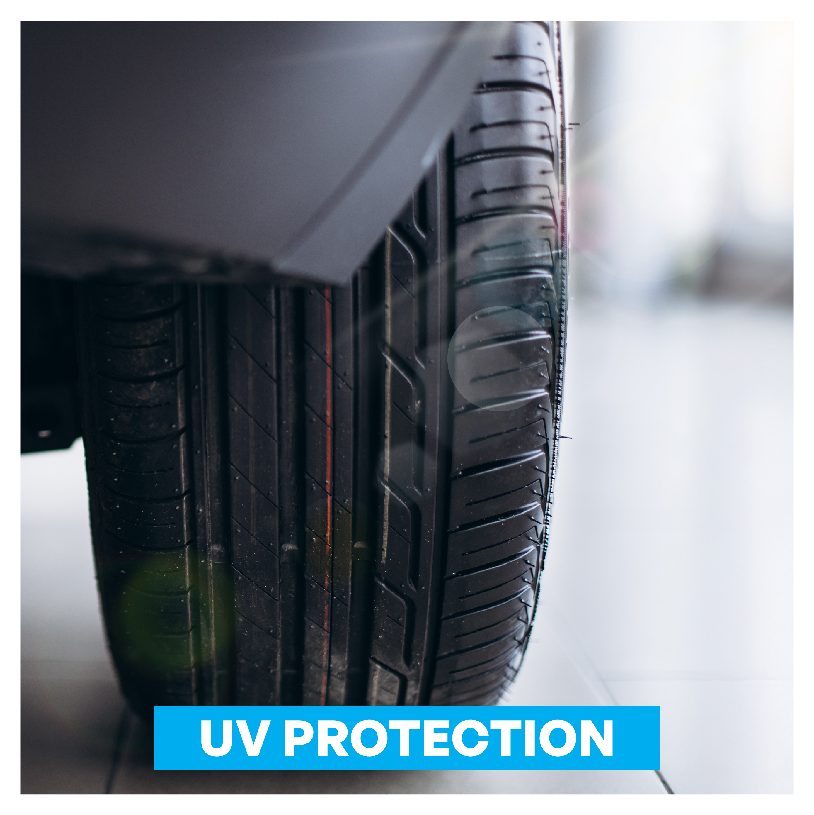Car tire with 'UV Protection' label on a blurred background